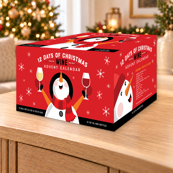 Red Joyful Snowman Wine Advent Calendar - 12 Mini Bottles - 187 ml in a warm holiday setting