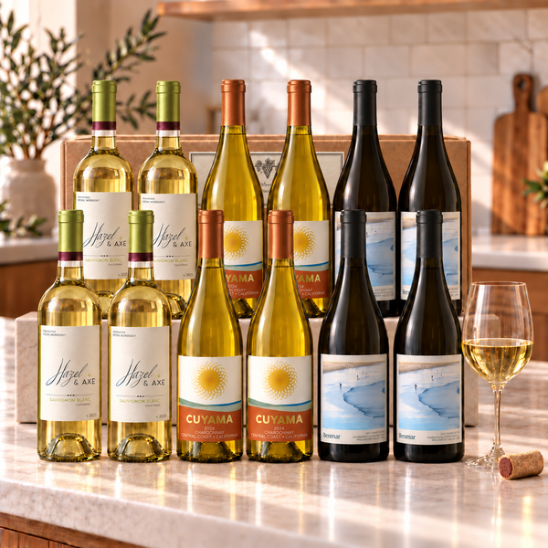 Illustrative 12-bottle white wine selection on a rectangular marble platform with a branded shipping box behind the bottles