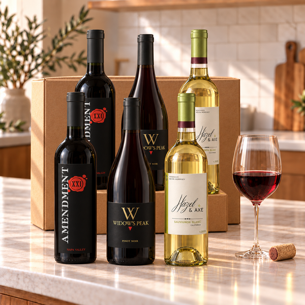 Illustrative 6-bottle mixed red and white wine selection on a kitchen counter