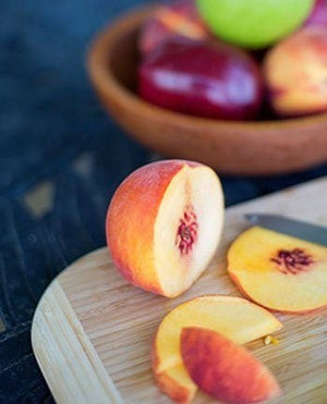 fruit club with sliced fruit on cutting board