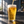 Golden craft beer being poured into a clear pint glass