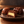 Illustrative close-up of chocolate confections, including one cut open to show its light-colored center