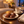 Illustrative evening serving scene with chocolate confections and a warm drink