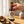 Hand lifting a Paulaner Märzen bottle from a cropped shipping carton; illustrative selection