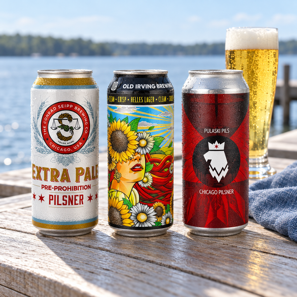 Illustrative selection of three craft pilsner and lager cans beside golden beer on a waterside table