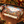 Craft beer advent calendar on a wooden counter beside three craft beer cans