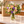 Colorful mixed flower bouquet styled in a decorative vase on a kitchen counter
