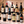 Illustrative twelve distinct international red wines on marble; actual selections vary