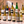 Illustrative twelve distinct international white wines on marble; actual selections vary