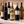 Illustrative 6 distinct red and white wines arranged on marble; actual selections vary