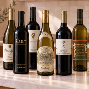 Illustrative 6 distinct red and white wines arranged on marble; actual selections vary