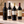 Illustrative 4 distinct red wines arranged on marble; actual selections vary