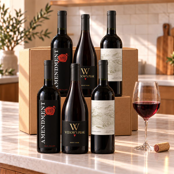 Illustrative 6-bottle red wine selection on a kitchen counter