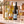 Illustrative 6-bottle white wine selection on marble with Wine of the Month Club branded shipping box behind the bottles
